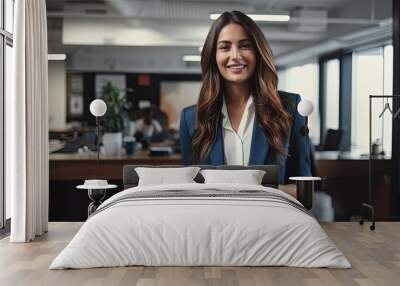 A caucasian female businesswoman happily makes a call in her office Wall mural