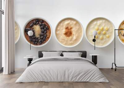 A classic Turkish rice pudding is displayed in various containers on a white surface, with an empty space for adding text or images, seen from above. Wall mural