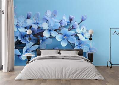 A copy space image featuring blue spring flowers set against a matching blue backdrop Wall mural