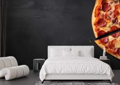 A gray background showcases a top down view of an Italian pizza split in half creating a flat lay banner that offers copy space for text Wall mural