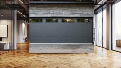 A home s exterior showcasing gray double garage doors and a stone wall with plenty of copy space for images Wall mural