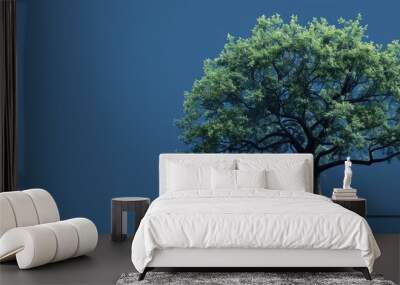 A large tree design featuring leaves and a trunk on a blank blue copy space image Wall mural