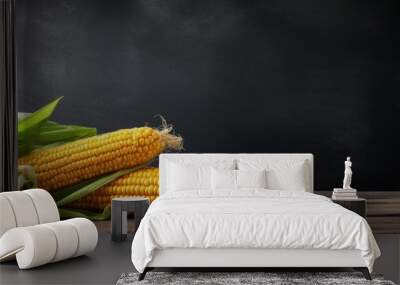 A photo of organic sweet corn on a kitchen table with a dark gray textured background providing ample copy space Wall mural