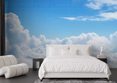 A picturesque copy space image featuring a serene blue sky background adorned with fluffy white clouds Wall mural