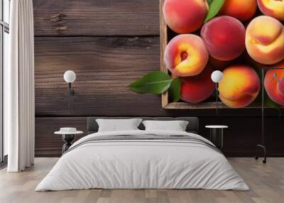 A pile of fresh organic peaches is showcased on a wooden tray with rope handles sitting on a white wood textured table It represents local produce promoting clean eating The image provides a close up Wall mural