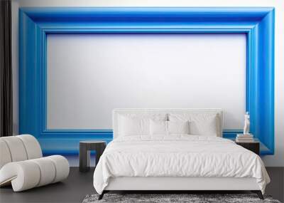 A plastic blue picture frame is shown in a copy space image against a white background Wall mural