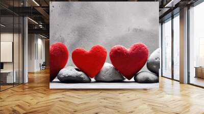 A row of red hearts is displayed on a stone surface creating a Valentine s Day and love themed background There is room for text in the image. Creative banner. Copyspace image Wall mural