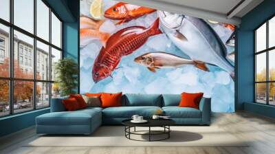 A selection of fresh fish and seafood on ice, seen from above, with empty space for text. Wall mural