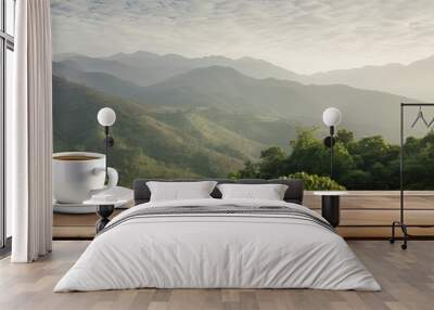 A white coffee cup rests on a wooden table the backdrop showcasing a serene mountain landscape in the distance. Creative banner. Copyspace image Wall mural