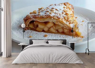 A white plate holds an apple pie danish featuring apple filling powdered sugar crumble and set against a white background with copy space image Wall mural