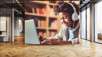 African American teen studying online at home using a laptop Concept of technology education and e learning Wall mural