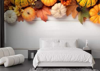 An autumn themed mockup frame with pumpkins and festive decorations for Thanksgiving Day displayed on a white wooden background providing ample copy space for images Wall mural