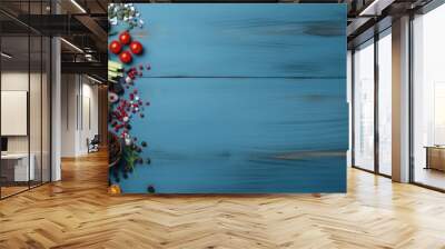 Blue wooden background with copy space image featuring a vibrant arrangement of fresh vegetables and seeds Wall mural