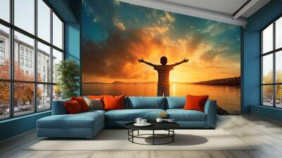 Boy s silhouette in sunset over sea representing religion worship prayer and praise Wall mural