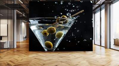 Classic dry martini cocktail with green olives on a black background with splashes and space for your text as shown in the copy space image Wall mural