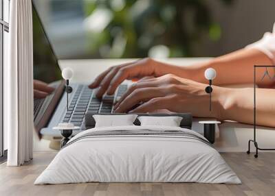 Close up of female hands typing on laptop Wall mural