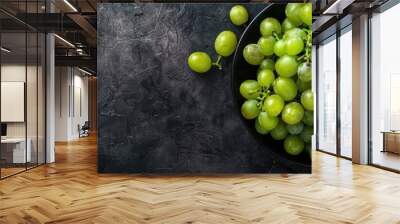 Close-up top view of ripe, big, beautiful green grapes with a mix of sweet and sour flavors, making them a delicious and useful option for healthy eating with copy space image. Wall mural