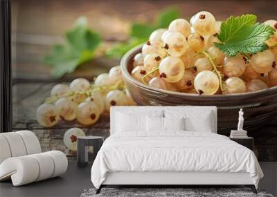 Close up view of a bowl with fresh white currant berries on a wooden table ideal for adding text in the empty area in the photo a copy space image Wall mural