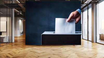 Closeup of a man placing his vote into a ballot box on a dark blue backdrop providing ample space for text Wall mural