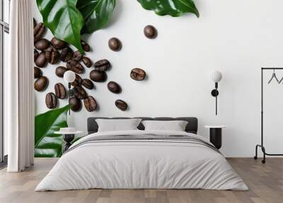 Coffee beans and leaves arranged on a white background with copy space image. Wall mural