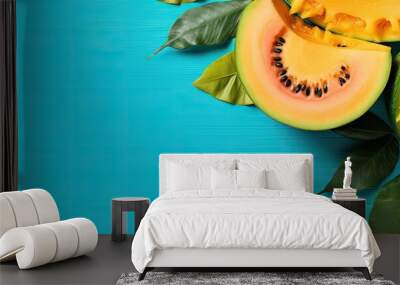 Copy space image of a raw vegan food concept with a pop art design featuring sweet melon over tropical green palm leaves on a vibrant turquoise background Wall mural