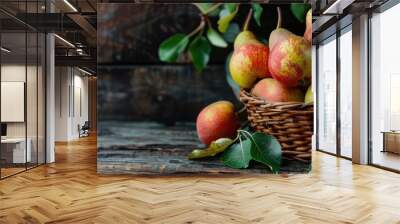 Copy space image of organic ripe pears displayed in a rustic basket on a wooden table promoting healthy eating Wall mural