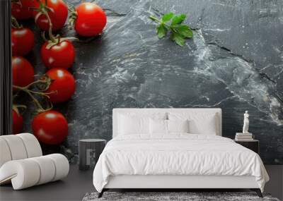 Copy space image with fresh and tasty cherry tomatoes on a dark stone background Wall mural