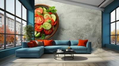 Fresh vegetable salad in a bowl with tomato and cucumber on a grey background ideal for copy space image Wall mural