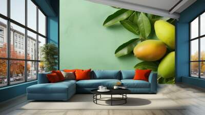 Green mangoes on isolated pastel background Copy space Wall mural