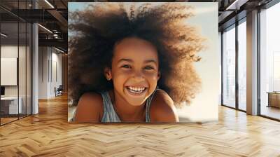 Happy black mother and daughter playing on beach with room for text Sister gives piggyback ride to little girl by the shore Lovely child hugs her mom Wall mural