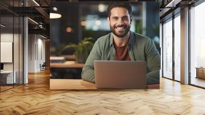 Happy freelancer man enjoying remote work and self employment smiling at camera Wall mural