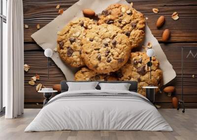 Homemade gluten free oatmeal cookies with dark chocolate and nuts on white wooden background, top view. Healthy eating, ancient grain food concept. Wall mural