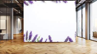 Lavender flowers and leaves frame and border isolated on white background. Top view, flat lay. Creative layout. Floral design element. Healthy eating and alternative medicine concept Wall mural