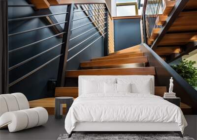 Luxurious home with a wooden and steel staircase viewed from below Wall mural