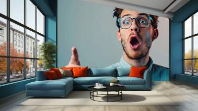 Middle age latin man wearing casual clothes and glasses pointing with finger surprised ahead open mouth amazed expression something on the front. Creative Banner. Copyspace image Wall mural