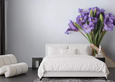 Mockup of a bouquet containing blue and purple irises on a light gray background for celebrations like birthdays March 8th International Women s Day and to expre Wall mural