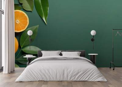 Oranges with green leaves and glass of orange juice on the floor Orange fruit and leaf with isolated pastel background Copy space Wall mural