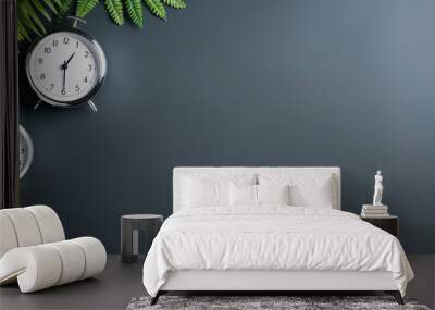 Photo of three clocks on a table with a plant, representing the passing of time and a peaceful ambiance with copy space Wall mural