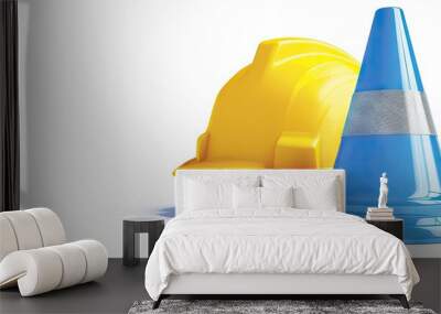 Realistic blue traffic cones and a yellow safety helmet are displayed on a white background depicting equipment for road safety with a safety first concept creating a copy space image Wall mural