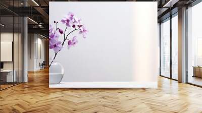 Sprig of purple orchid in transparent vase on white background with bright lighting, copy space, horizontal photo. Flower silhouette and blurred shadow mesh on wall. Orchidaceae, minimalist aesthetic. Wall mural