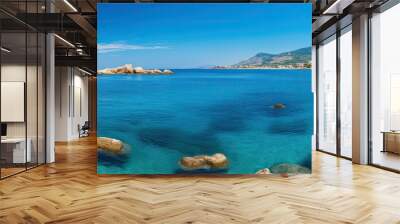 Sunny day along the rocky southern Italian coast with a vibrant blue Mediterranean Sea providing a serene backdrop for a copy space image. Wall mural