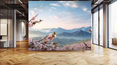 The scenic view of peach blossoms in full bloom against a backdrop of majestic mountains is captured in this copy space image Wall mural