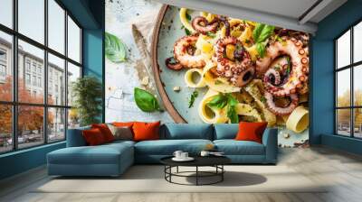 Top view copy space image featuring homemade octopus pasta with lemon and herbs, a Mediterranean dish set against a sunny summer tile background. Wall mural