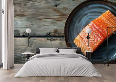 Top view of a cooked salmon fillet on a plate against a wooden background with copy space image. Wall mural