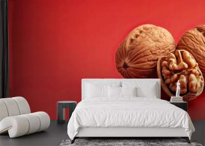 Vegan nut placed on red backdrop with copy space image high in vitamin content Wall mural