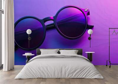 Vibrant sunglasses on a purple backdrop with ample copy space image Wall mural