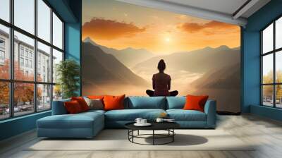 Woman meditating in side balance yoga position on the top of a mountains above clouds at sunset Zen meditation peace Wall mural