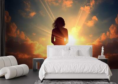 Woman praying with sky backdrop. silhouette concept Wall mural