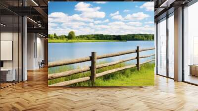 wooden fence on the river on a background of blue sky with clouds. Creative banner. Copyspace image Wall mural