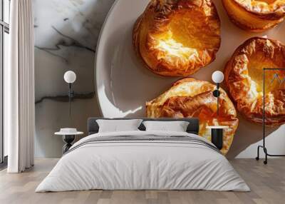 Yorkshire pudding on a plate with a light tile background creating a pleasing copy space image Wall mural